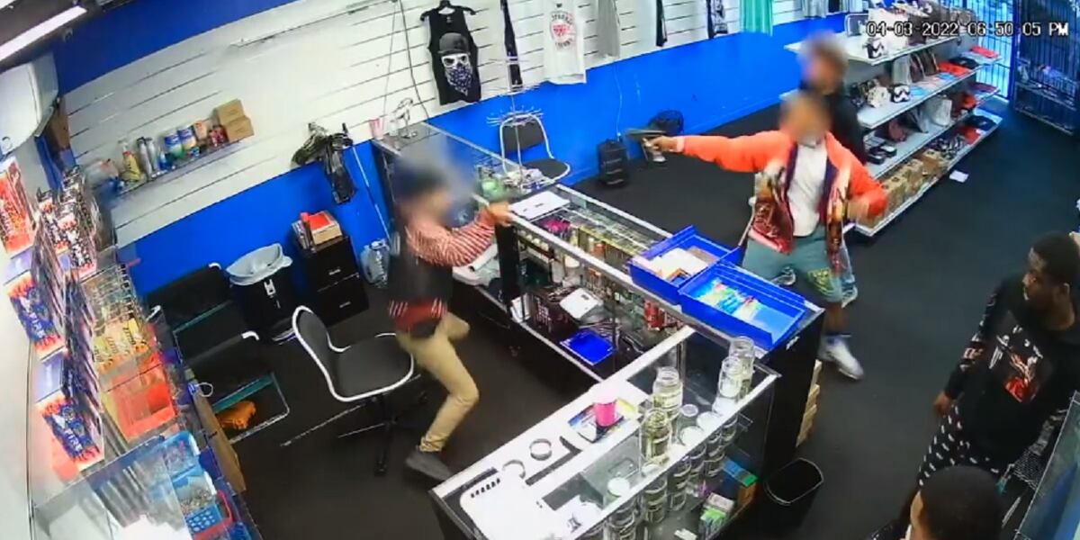 WARNING: Shocking video shows a gun battle between store employee and ...