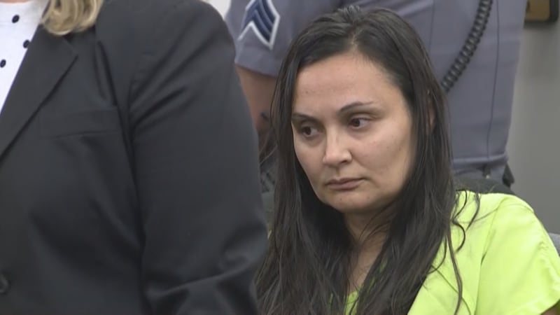 Stauch appears in court in green jail clothes from the El Paso County Jail