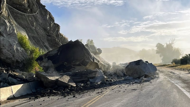 The rockslide after a big boulder was blasted into more manageable pieces.