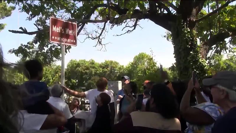 Family, friends, and community members came together on West Main to celebrate the unveiling...